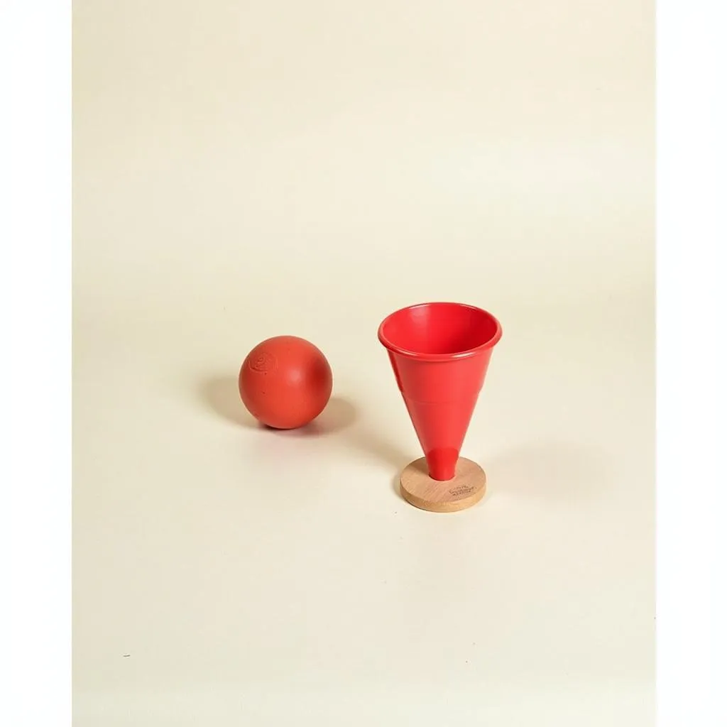 A classic cup and ball toy set with one cup and one ball.