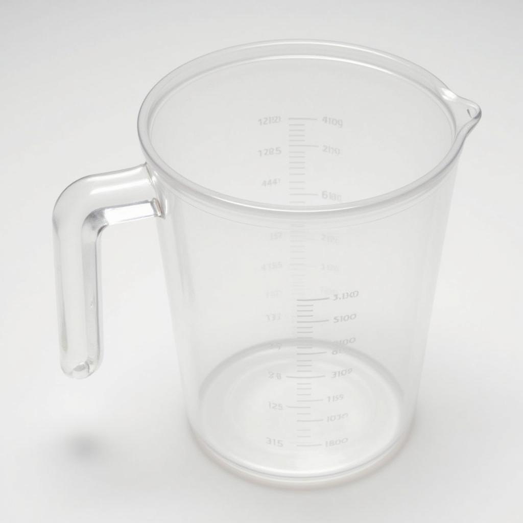 Plastic measuring cup with lid