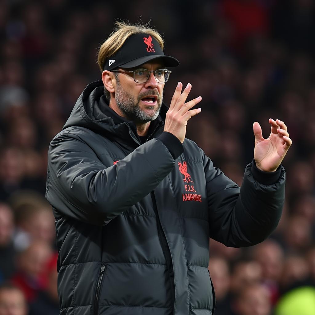 Klopp chỉ đạo các học trò bên đường pitch trong một trận đấu Carabao Cup.