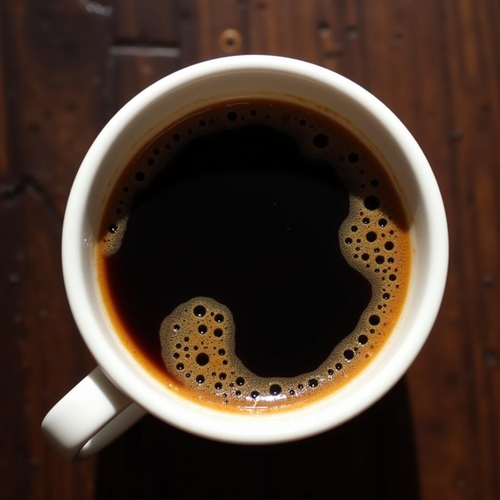 Close-up of a Lavazza espresso cup filled with a rich espresso, showing the crema